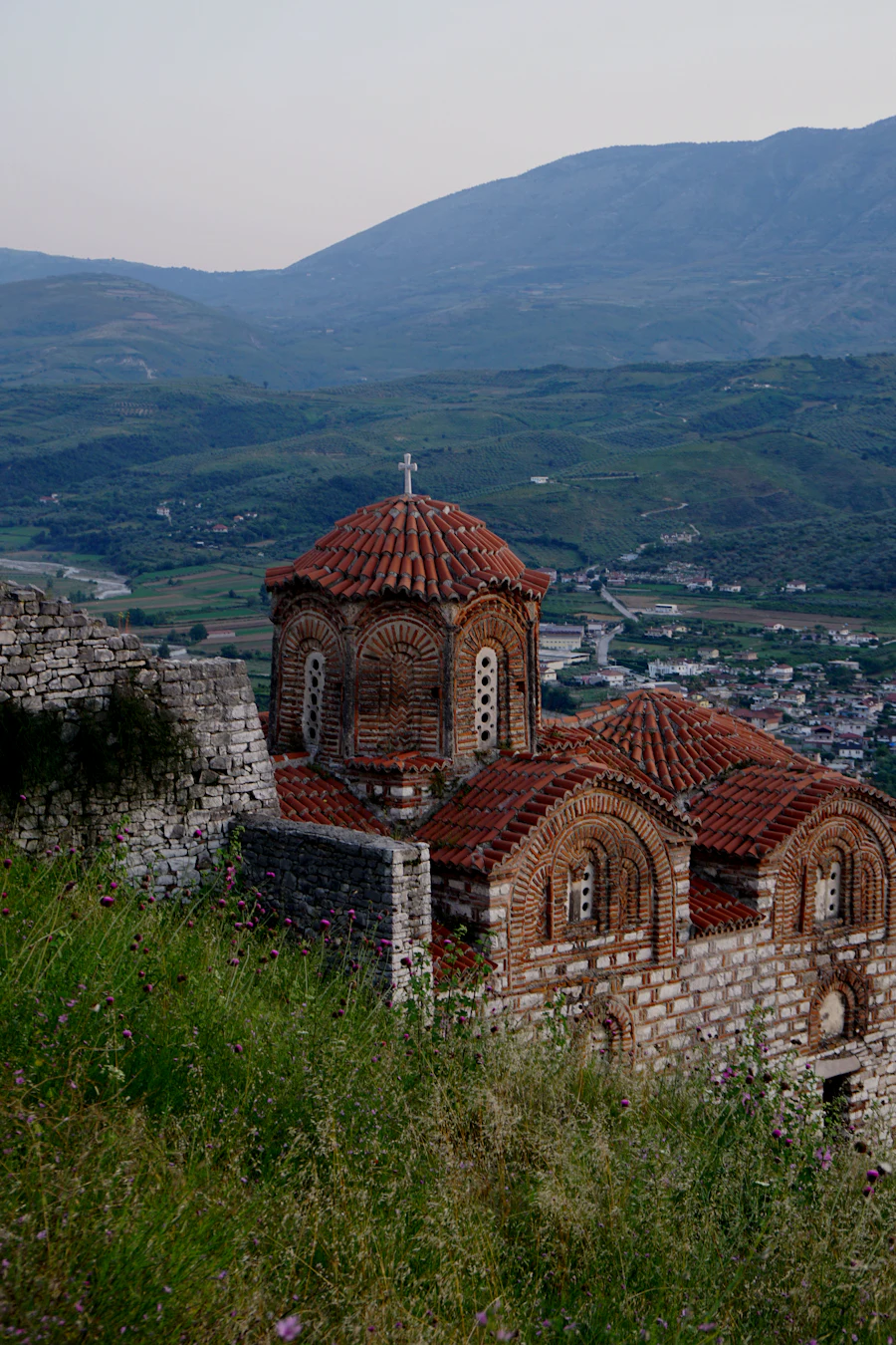 The Holy Trinity Church inside Berat Castle, with the valley and hills behind it
