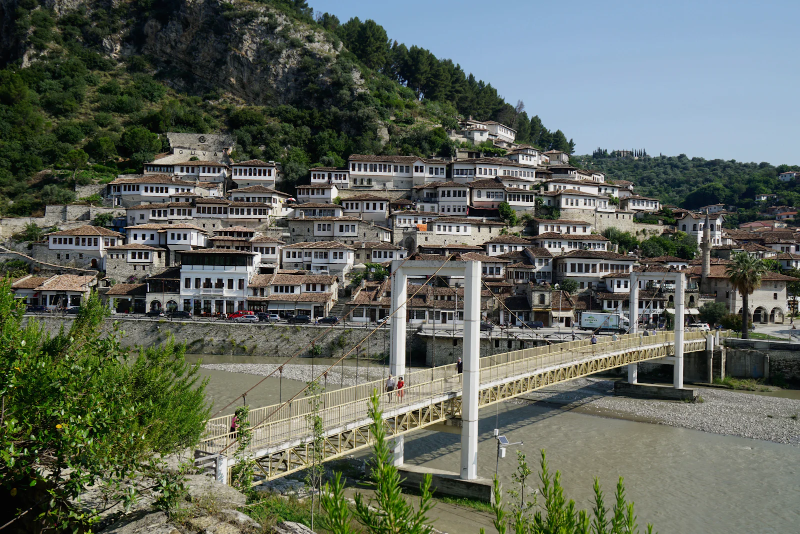 Berat: the Gorica footbridge and the white Ottoman houses of Mangalem climbing the hillside