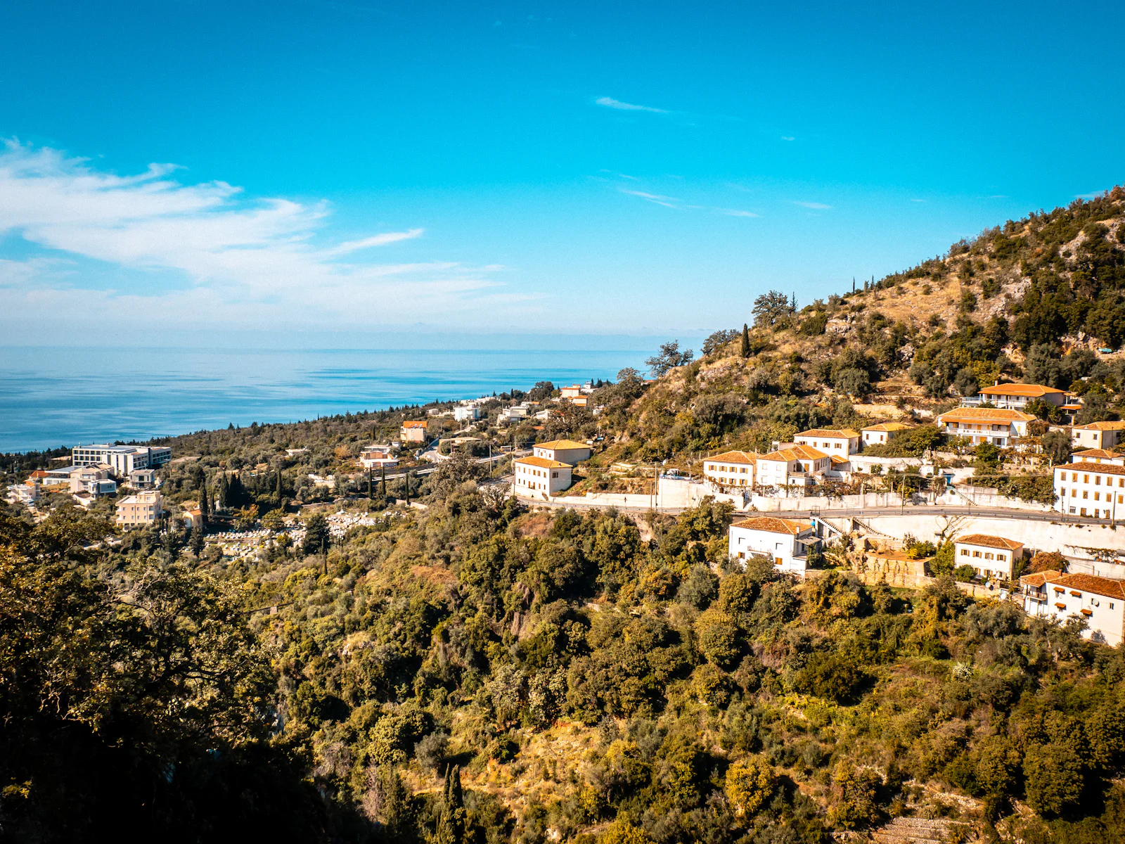 Dhërmi village on the mountainside above the Ionian Sea