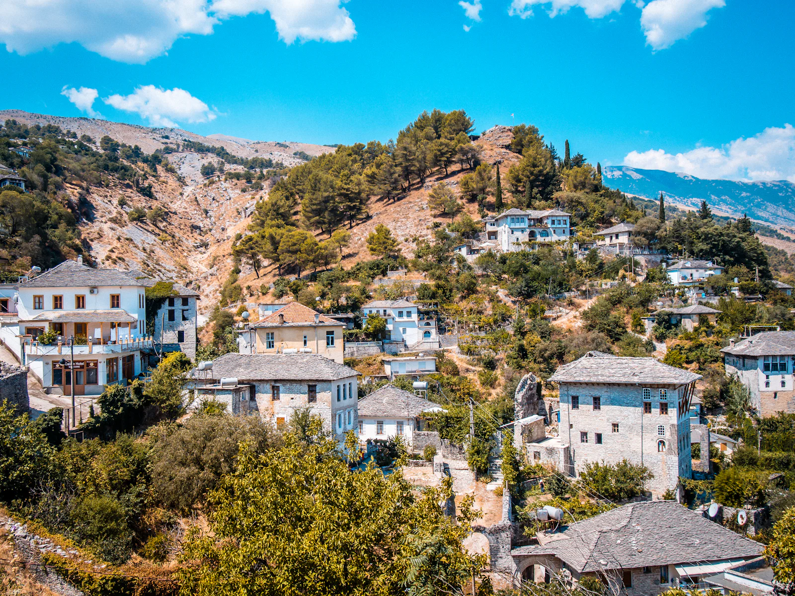 Stone-roofed houses of Gjirokastër spread across the hillside