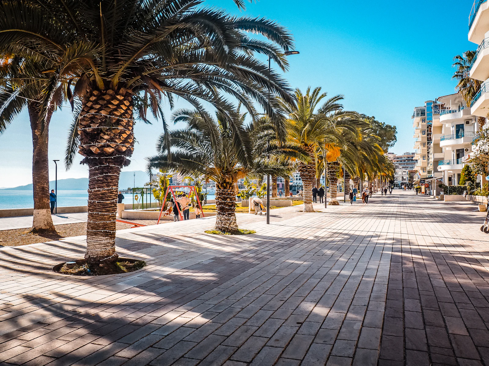 The palm-lined promenade along the bay in Sarandë